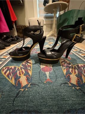 Gucci Black Leather Platform Iman Ankle-Strap Heels with Gold Accent. Size 38.5.
